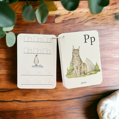 Open ring-bound cards showing a lynx and handwriting practice — Russian alphabet cards